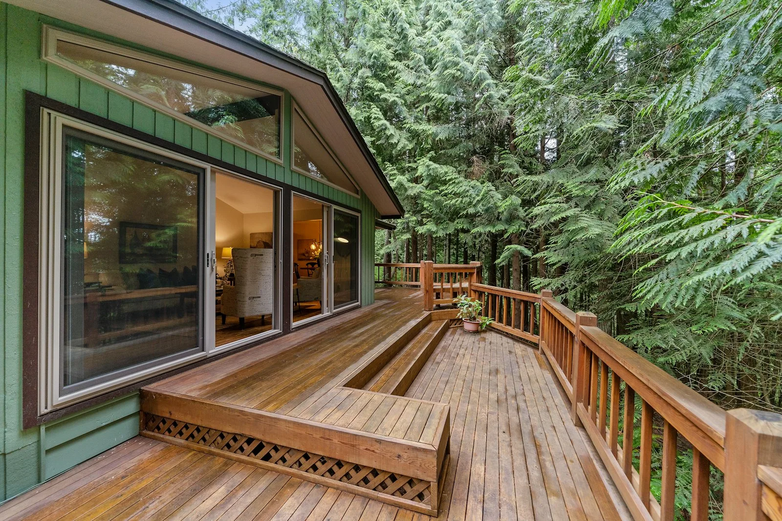 Timber deck attached to a house looking out into surrounding trees