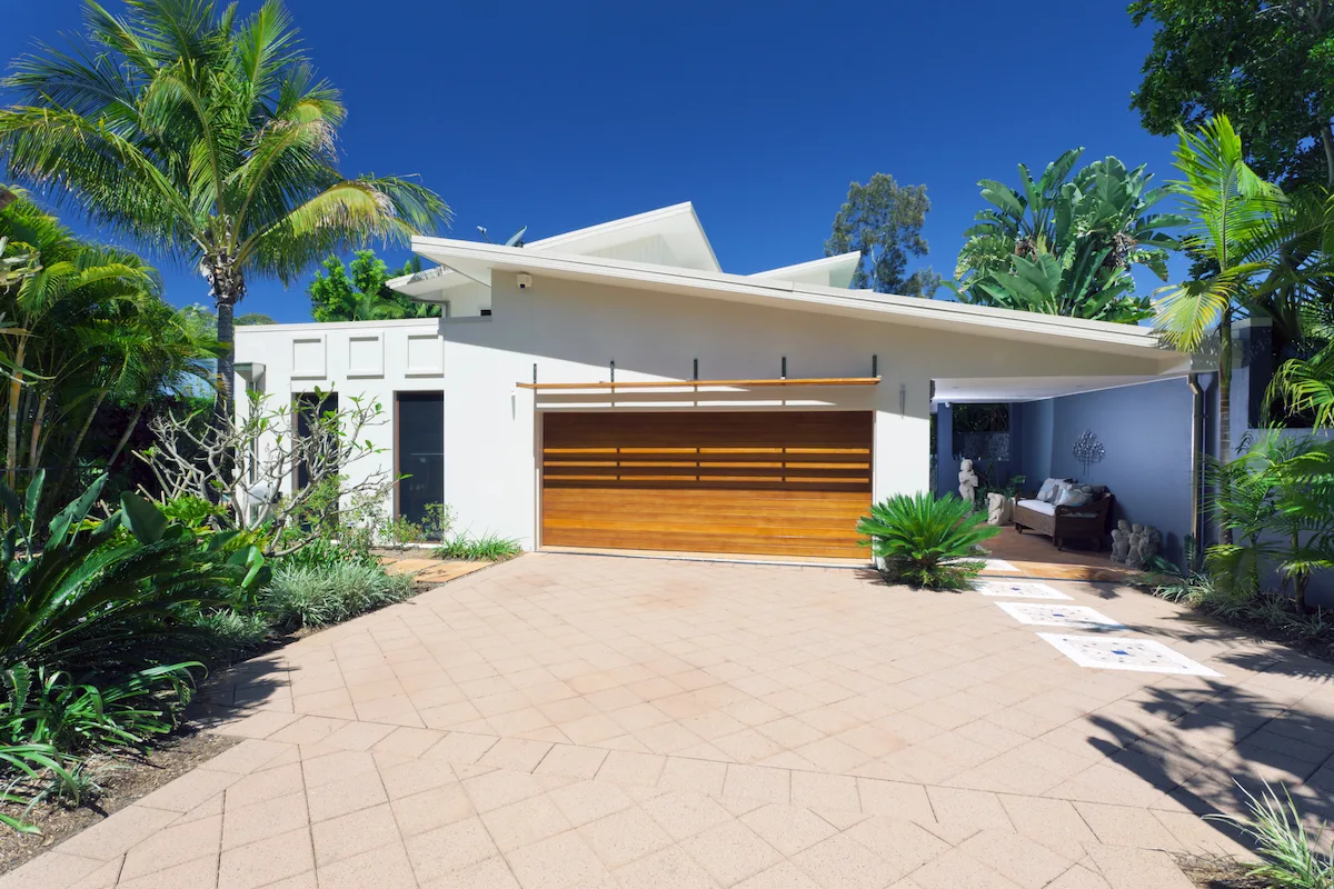 Tropical planting and driveway at a Peninsula home